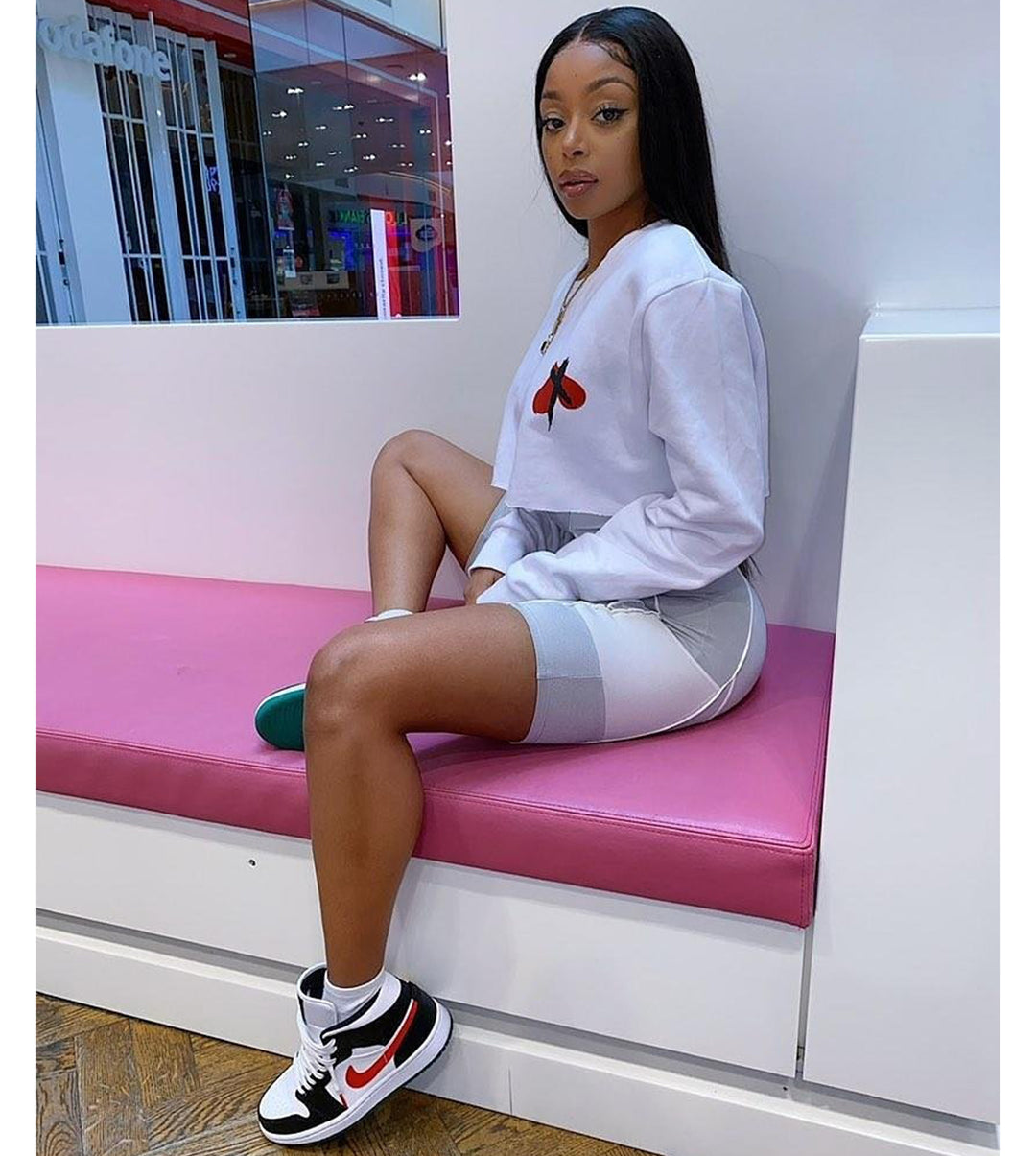 Model wearing the No Love White Jumper with graphic design